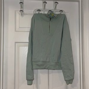 Quarter zip long sleeve sweatshirt teal in color